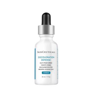 SkinCeuticals glass bottle of Discoloration Defense, a daily dark spot corrector for brighter, more even-looking skin.